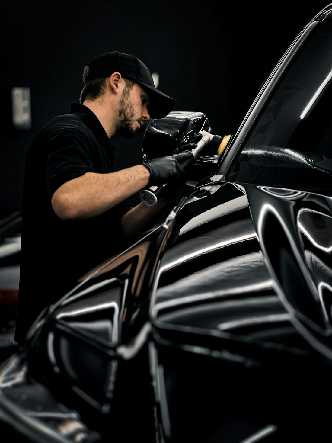 Detailer applying wax